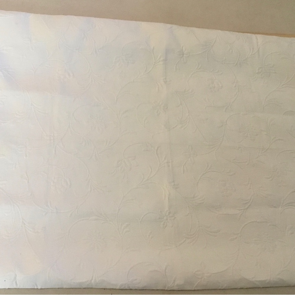 Headboard slipcover. Matelasse fabric in ecru.